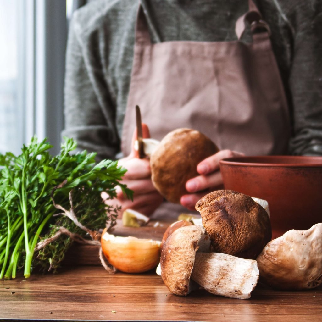 Personal chef preparing mushroom